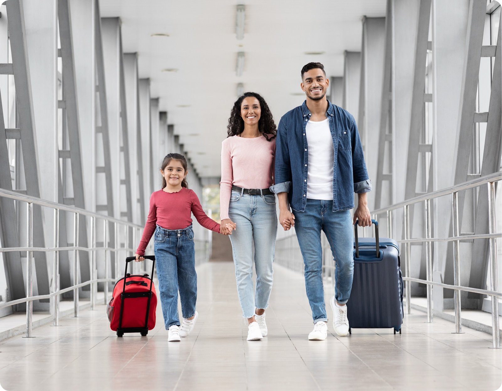 Family walking together at an airport terminal