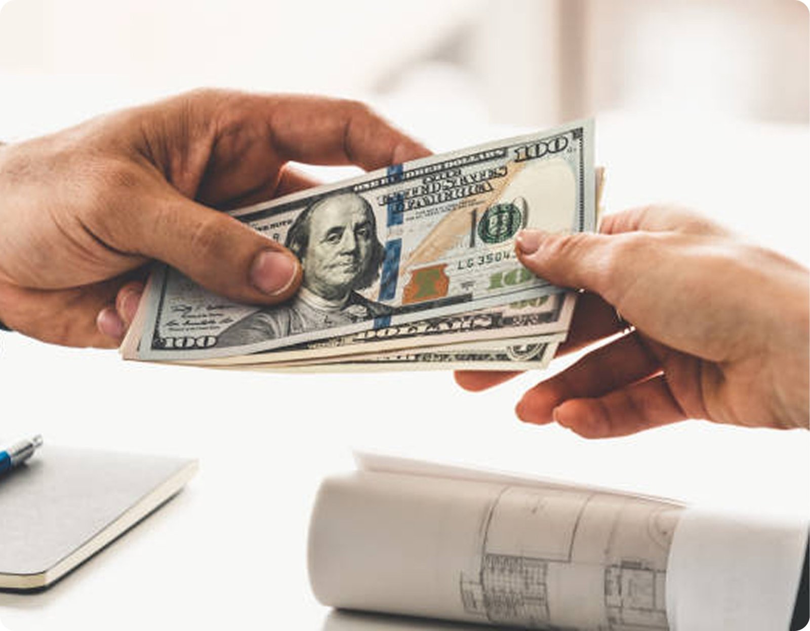 Hands exchanging US currency